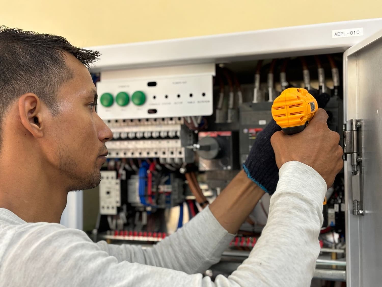 Low-voltage technician working cleanly on a jobsite for a builder